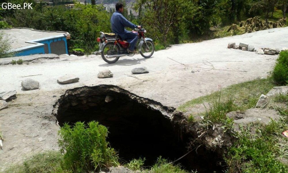 Massive Sinkhole Blocks Karimabad Road, Poses a Threat to Pedestrians