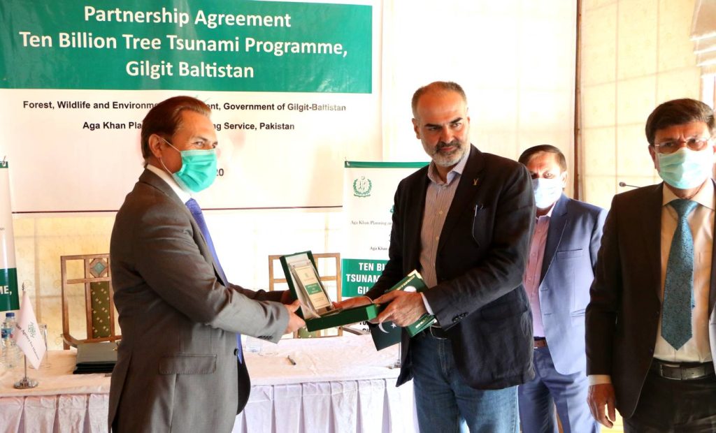 Mr.Nawab Ali Khan, CEO, AKAH,P is presenting a token of appreciation and partnership to Mr. Shah Zaman, Secretary, Forest and Wildlife, Department of Gilgit-Baltistan 